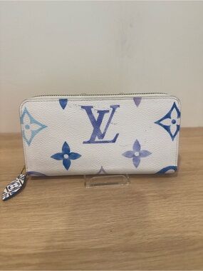 Louis Vuitton White Blue Monogram Zip Around Wallet by the pool print